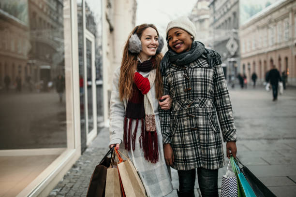 istock Two young women shopping for Christmas 1174385006