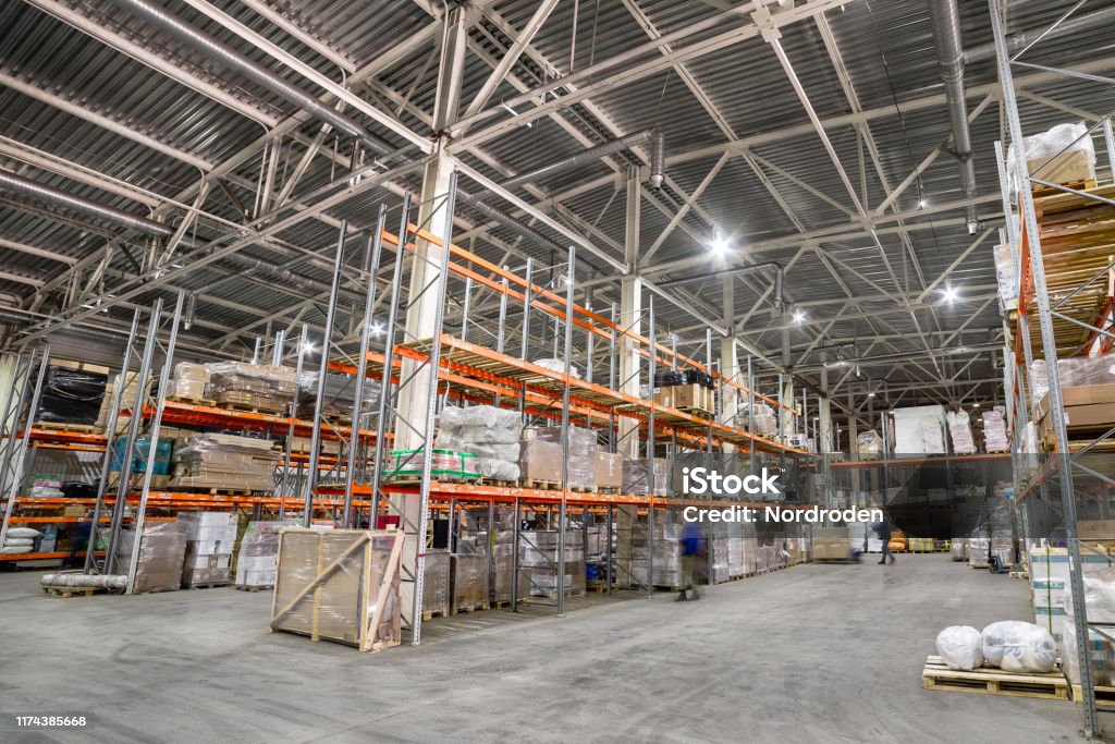 Large hangar warehouse industrial and logistics companies. Large hangar warehouse industrial and logistics companies. Warehousing on the floor and called the high shelves. Artist's Palette Stock Photo