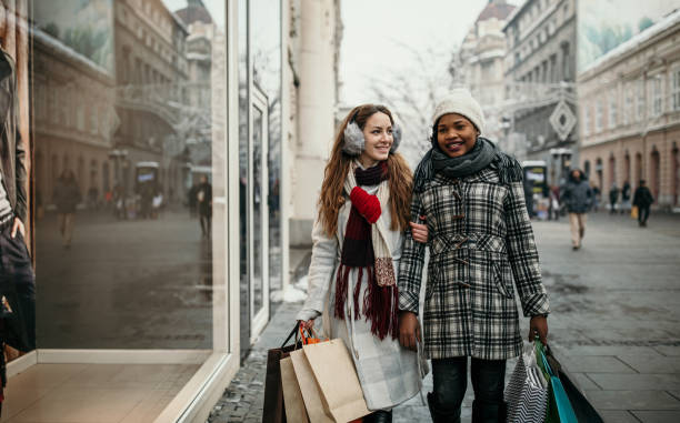 istock Two young women shopping for Christmas 1174386897