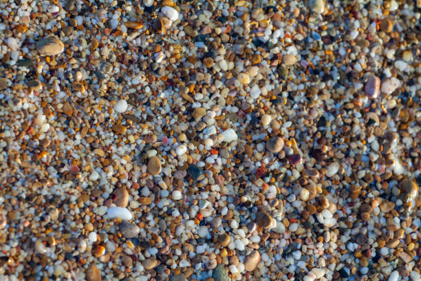 istock sea pebbles colored granite on the beach 1174391234