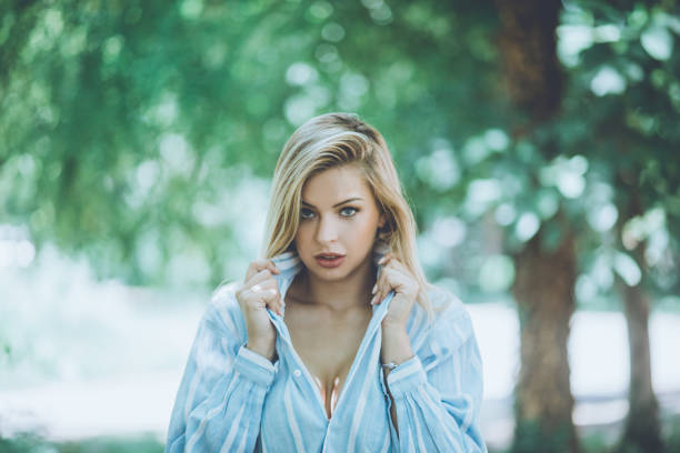 It is dangerous to challenge a beautiful woman. Beauty woman in the nature.