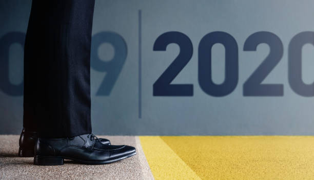 2020 Year Concept. Low Section of Businessman on Formal Business Dress Get Ready to Moving Forward from 2019 to New Year Challenge. Cropped Image. Side View 2020 Year Concept. Low Section of Businessman on Formal Business Dress Get Ready to Moving Forward from 2019 to New Year Challenge. Cropped Image. Side View 'formal dress' stock pictures, royalty-free photos & images