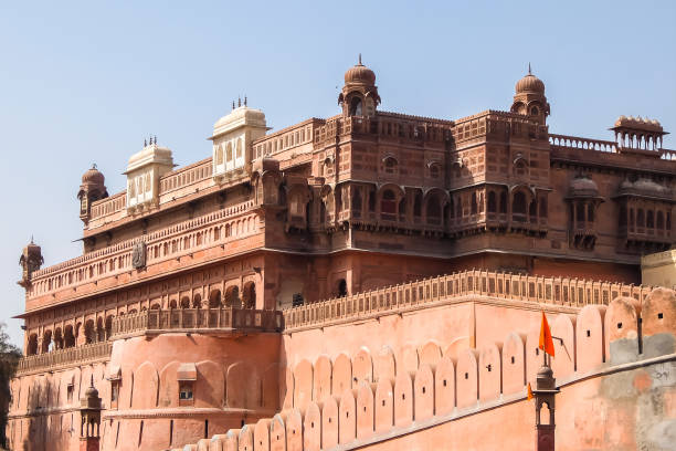 People walking in front of the Patrika Gate at Jaipur city, Rajasthan, India.  Jaipur city is the state capital, has more than three million inhabitants, and is a UNESCO World Heritage Site.