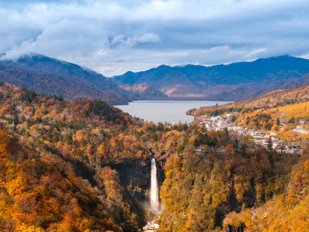 istock Kegon waterfall with autumn tree and mountain in Nikko, Japan 1174395124