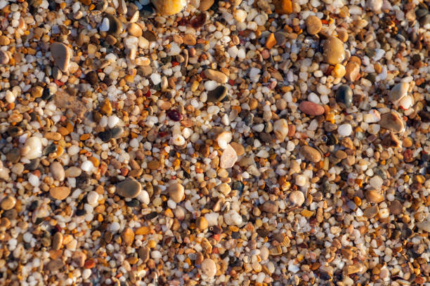 istock sea pebbles colored granite on the beach 1174396720