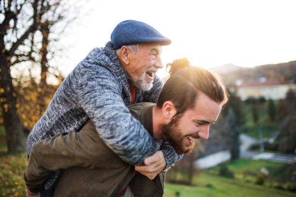 istock Senior father and his son walking in nature, having fun. 1174396869