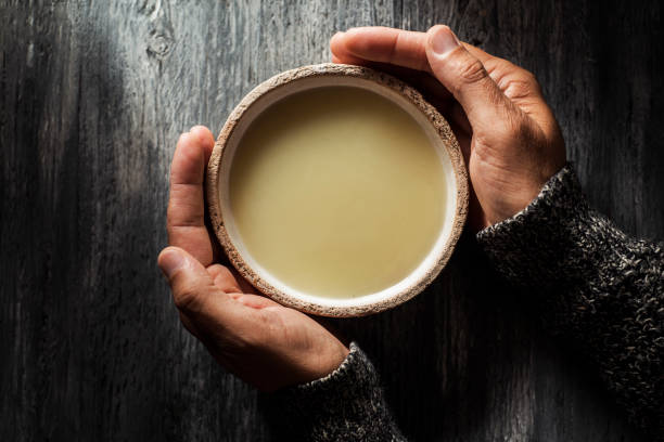 istock man warming up with a bowl of hot soup 1174399945