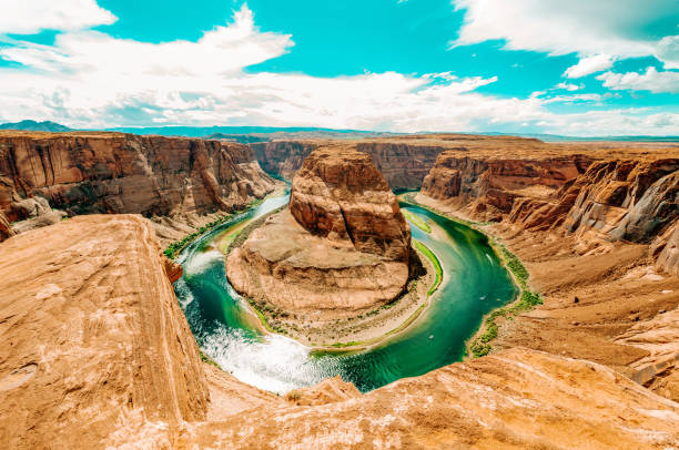 Horseshoe Bend a sunny day at Grand Canyon Horseshoe Bend, where the Colorado River runs through the spectacular Grand Canyon, a sunny day in Utah, USA. red rocks state park arizona photos stock pictures, royalty-free photos & images