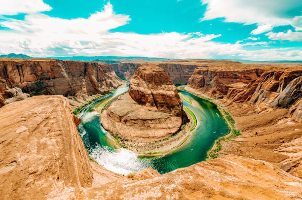Horseshoe Bend a sunny day at Grand Canyon Horseshoe Bend, where the Colorado River runs through the spectacular Grand Canyon, a sunny day in Utah, USA. horseshoe bend river stock pictures, royalty-free photos & images