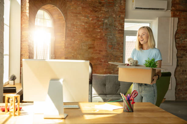 istock A young businesswoman moving in office, getting new work place 1174401385