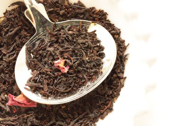 istock dried rose flower and tea leaves 1174402369