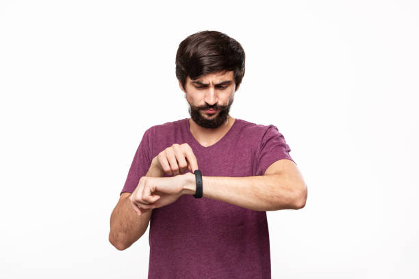 istock Excited brunet bearded man with moustaches checking notification with smart watches. Using modern technologies in everyday life. 1174402820
