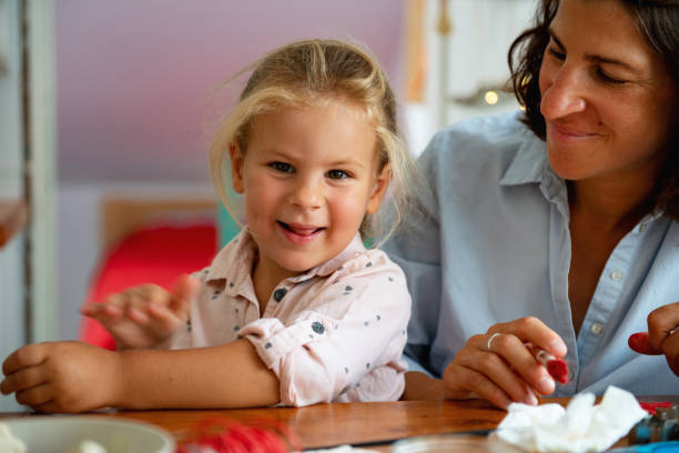istock Smiling mother and daughter in the Kitchen 1174404886