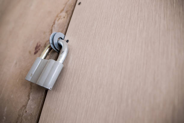 istock Old padlock on the wooden doors 1174405442