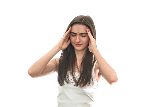 istock Young woman with headache isolated on white 1174407773