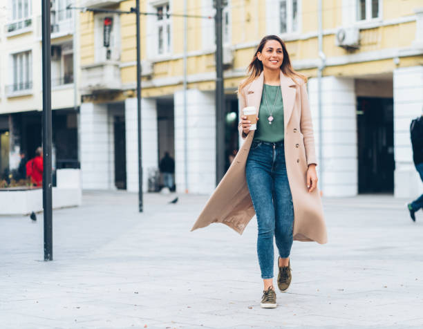 istock Woman walking on the street 1174409404