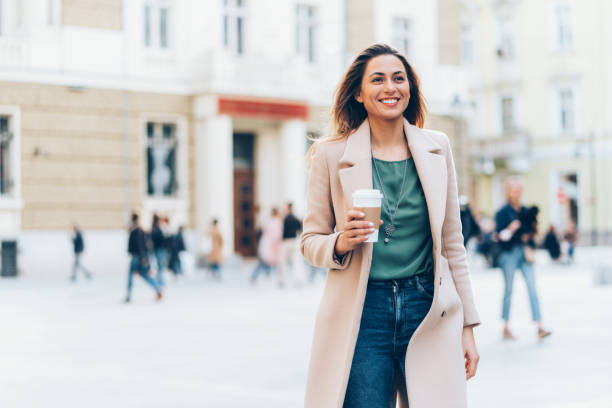 istock Woman walking on the street 1174409413