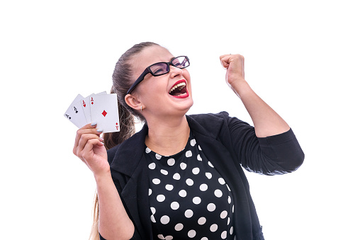 Woman with four aces isolated on white