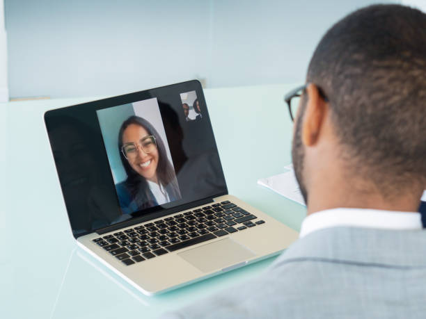 istock Happy business team talking through video call 1174410502