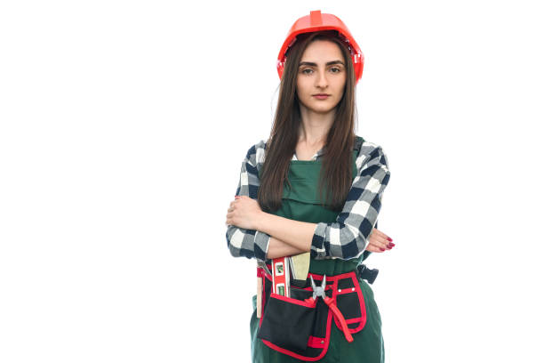 istock Woman in tool belt and coverall isolated on white 1174412090