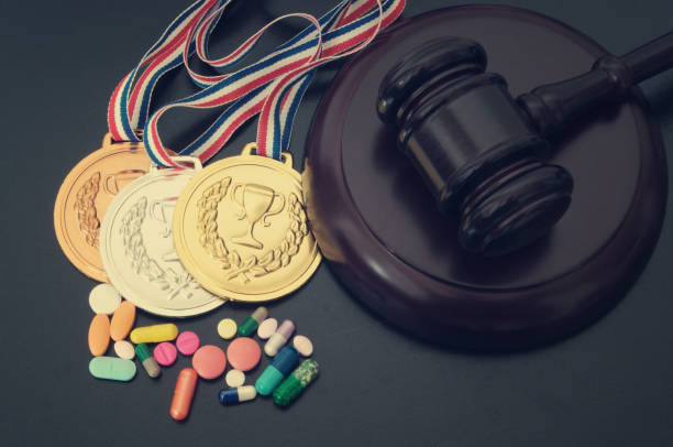 Doping in sport. Gavel, medals and tablets with syringe Doping in sport concept. Gavel, medals and tablets with syringe on table anti doping stock pictures, royalty-free photos & images