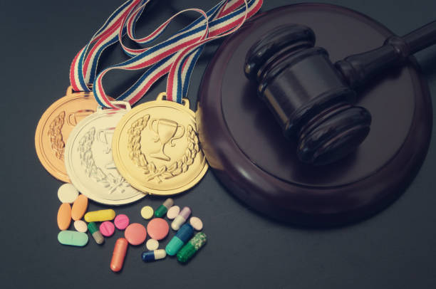 doping in sport. gavel, medals and tablets with syringe - doping imagens e fotografias de stock