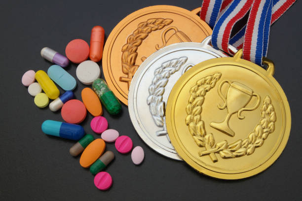 Doping in sport theme, drugs and medals Doping in sport theme, drugs and medals on black background anti doping stock pictures, royalty-free photos & images