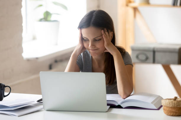 istock Bored girl student feel unmotivated studying at home 1174414368