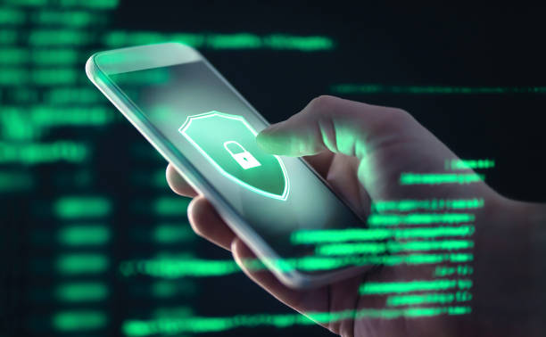 istock Mobile phone personal data and cyber security threat concept. Cellphone fraud. Smartphone hacked with illegal spyware, ransomware or trojan software. Hacker doing online scam. 1174418677