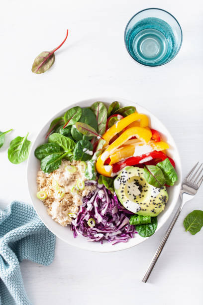 istock veggie couscous lunch bowl with avocado, bell peppers, spinach and red cabbage 1174418942