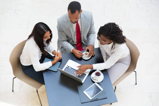 istock Business colleagues working on project during coffee break 1174419852