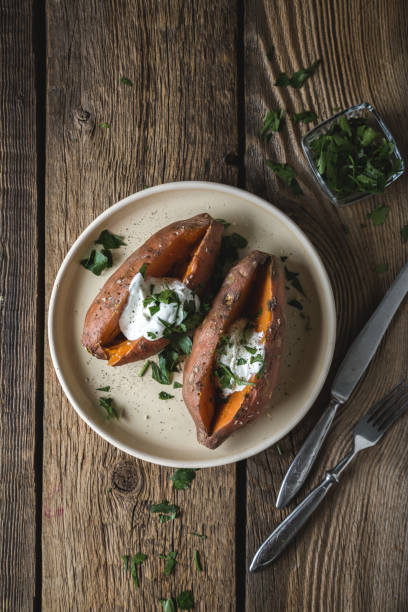 Baked sweet potato with cream cheese, yogurt and fresh herbs