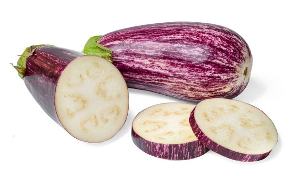 istock Whole and sliced eggplant graffiti. Isolation on a white background. Juicy bright colors. 1174420075