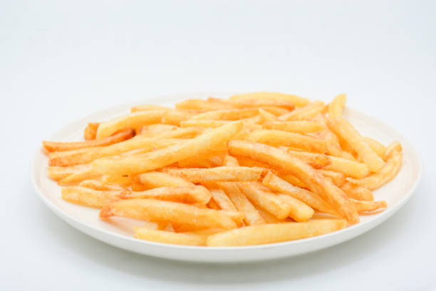 istock French fries on white dish and white background. 1174420143