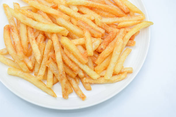 istock French fries on white dish and white background. 1174421749