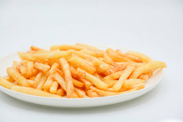istock French fries on white dish and white background. 1174422933