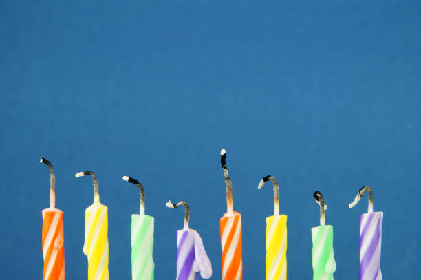 istock Colorful candles on blue background 1174423288