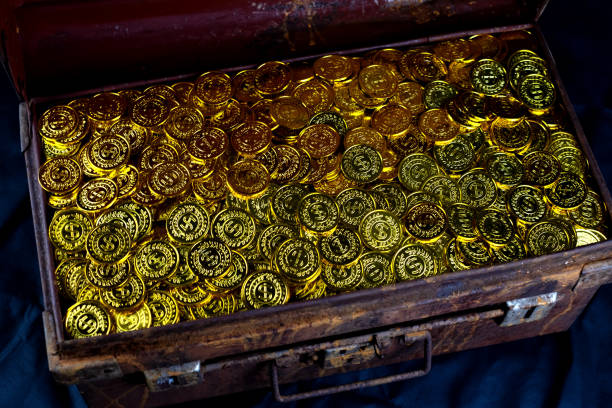 istock Stacking Gold Coin in treasure chest old 1174424141