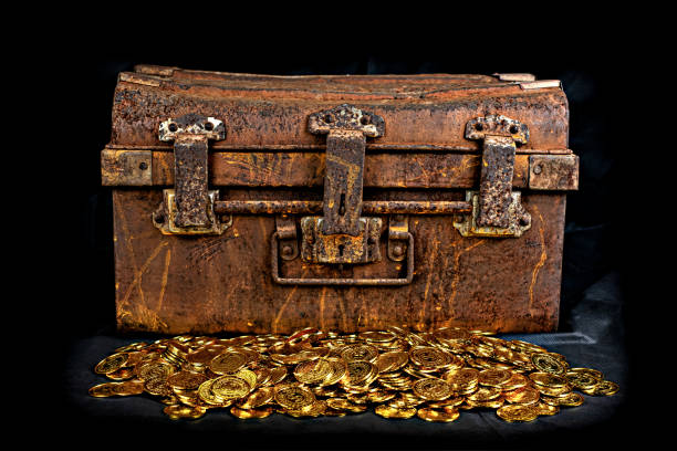 istock Stacking Gold Coin in treasure chest old 1174424166