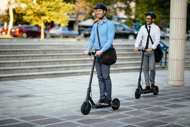 istock Businessmen riding electric scooter 1174424686