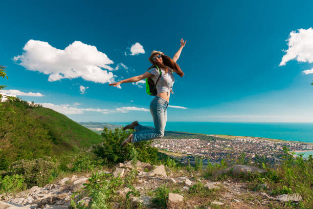 istock Woman  jumping in view Black sea 1174425686