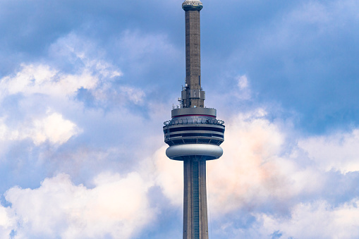 Toronto, Ontario, Canada-September 2, 2019: The CN Tower in the downtown district. The international landmark is a famous place and a tourist attraction.