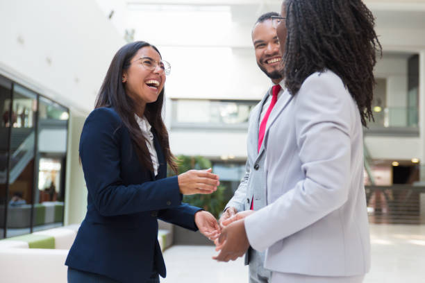 istock Joyful diverse business colleagues chatting 1174426769