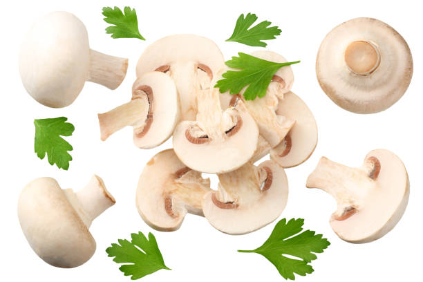 istock mushrooms with slices and parsley leaf isolated on white background. top view 1174426986