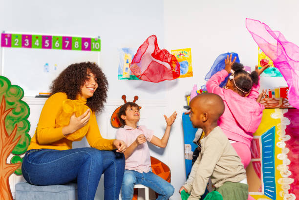 istock Kids throw handkerchief in fun developmental game 1174427574