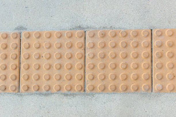 Block tactile paving for blind handicap. Tactile paving for blind handicap on tiles pathway, walkway for blindness people.