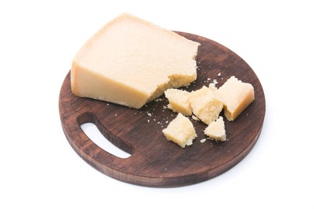 istock cheese pieces on a wooden cut board isolated 1174430864