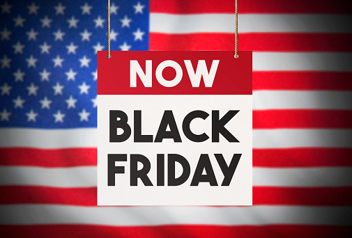 Calendar standing in front of the American flag and showing Black Friday Stock Image