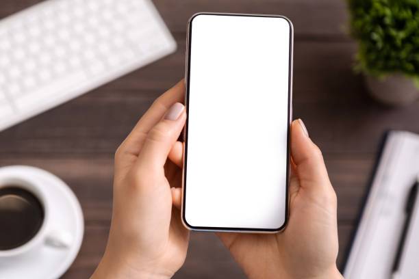 Woman demonstrating modern smartphone with blank white screen