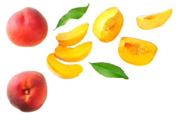 istock peach fruit with green leaf and slices isolated on white background. top view 1174433329